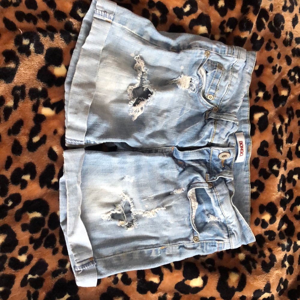 Ripped blue jean shorts